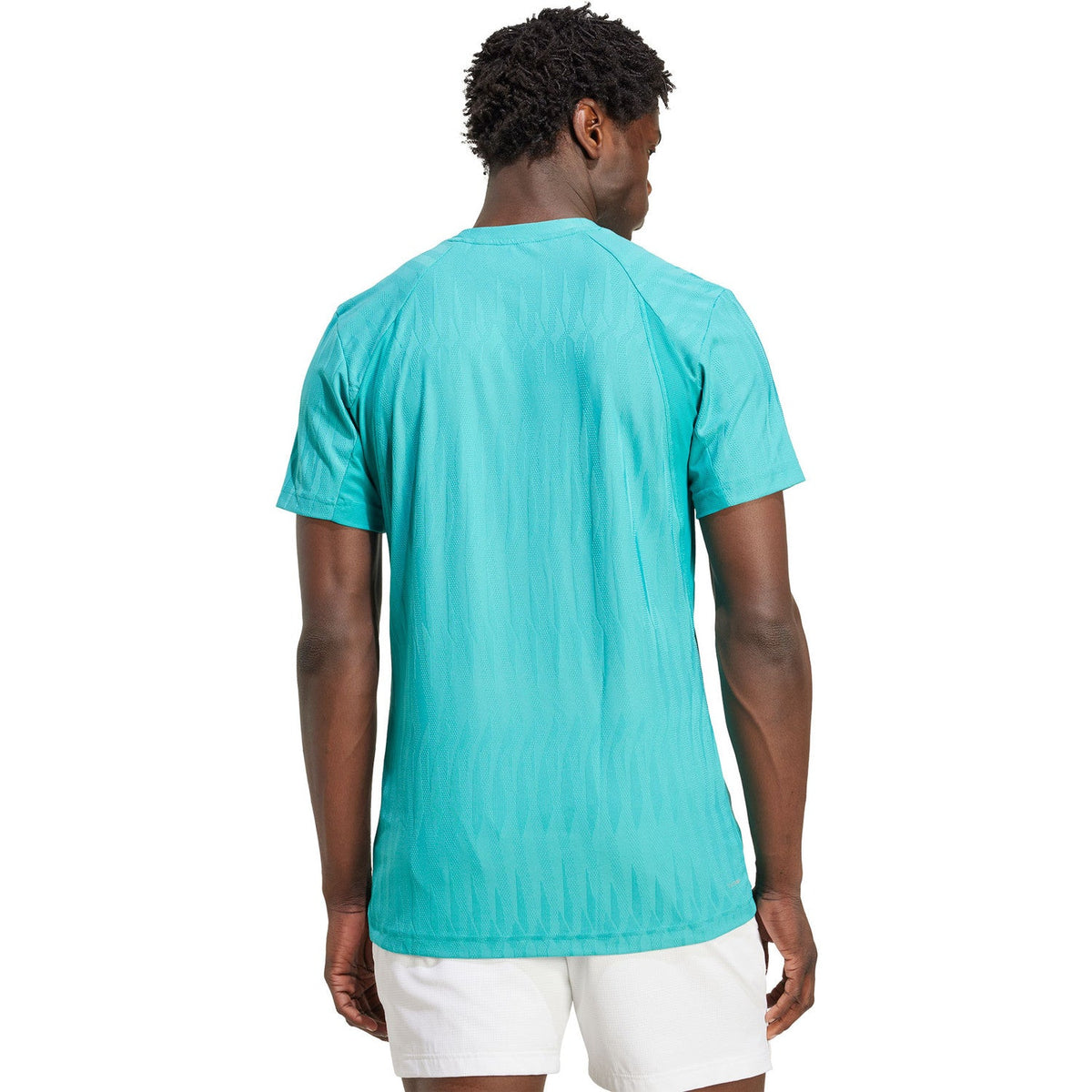 Achterzijde van het turquoise Adidas Freelift T-shirt, gedragen