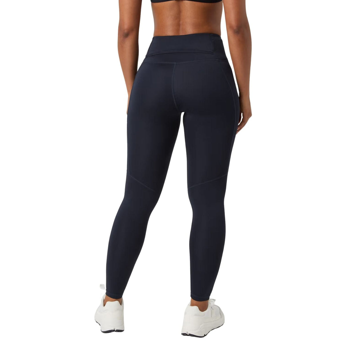 Achteraanzicht van de donkerblauwe Bjorn Borg Ace legging met brede tailleband op model