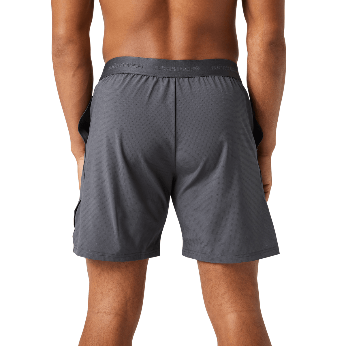 Achteraanzicht van de grijze Bjorn Borg Ace Pro short op model met rechte pijpen