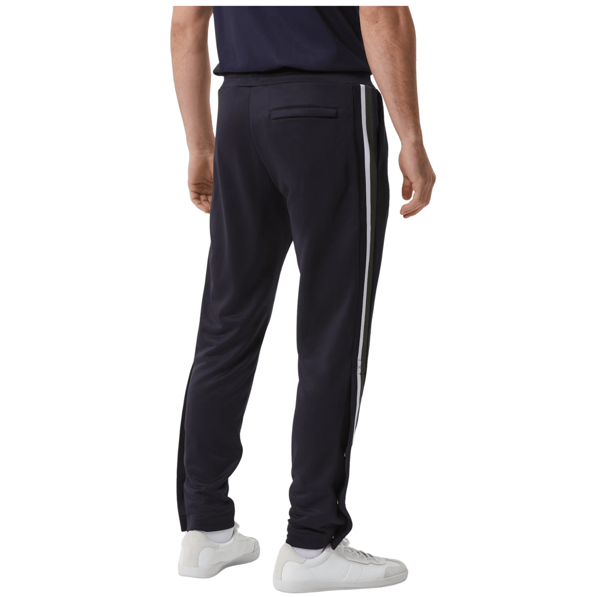 Zijaanzicht van de donkerblauwe Bjorn Borg Ace tapered broek met witte bies langs de pijp