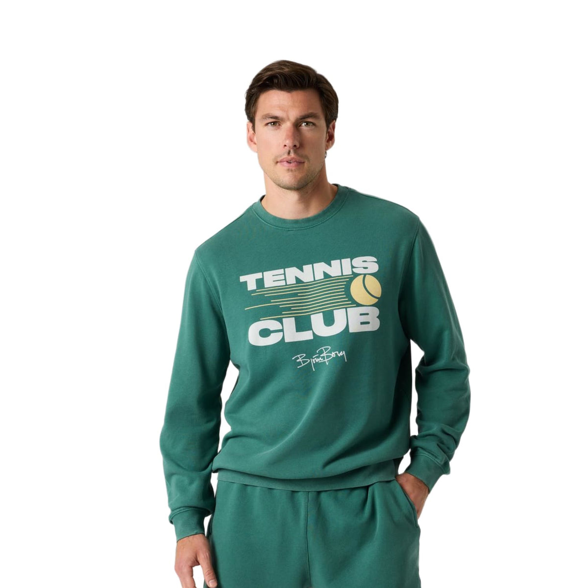 Herenmodel draagt het donkergroene Bjorn Borg Classic Print Sweatshirt met groene broek