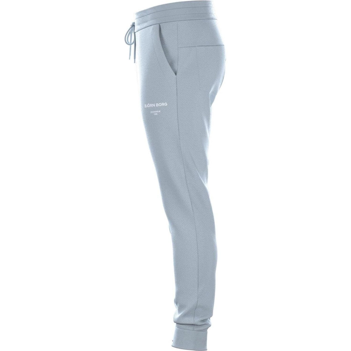 Zijaanzicht van de lichtblauwe Bjorn Borg Essential 1 Pants met logo op de broekspijp