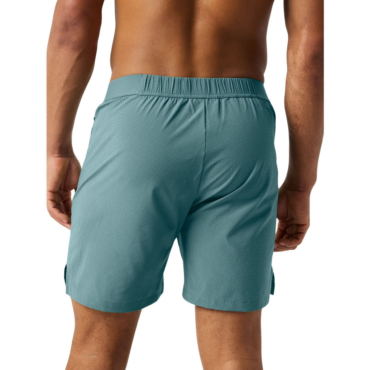 Pantalones cortos Bjorn Borg con cremallera, de color verde mar, vistos de perfil con abertura en la pernera