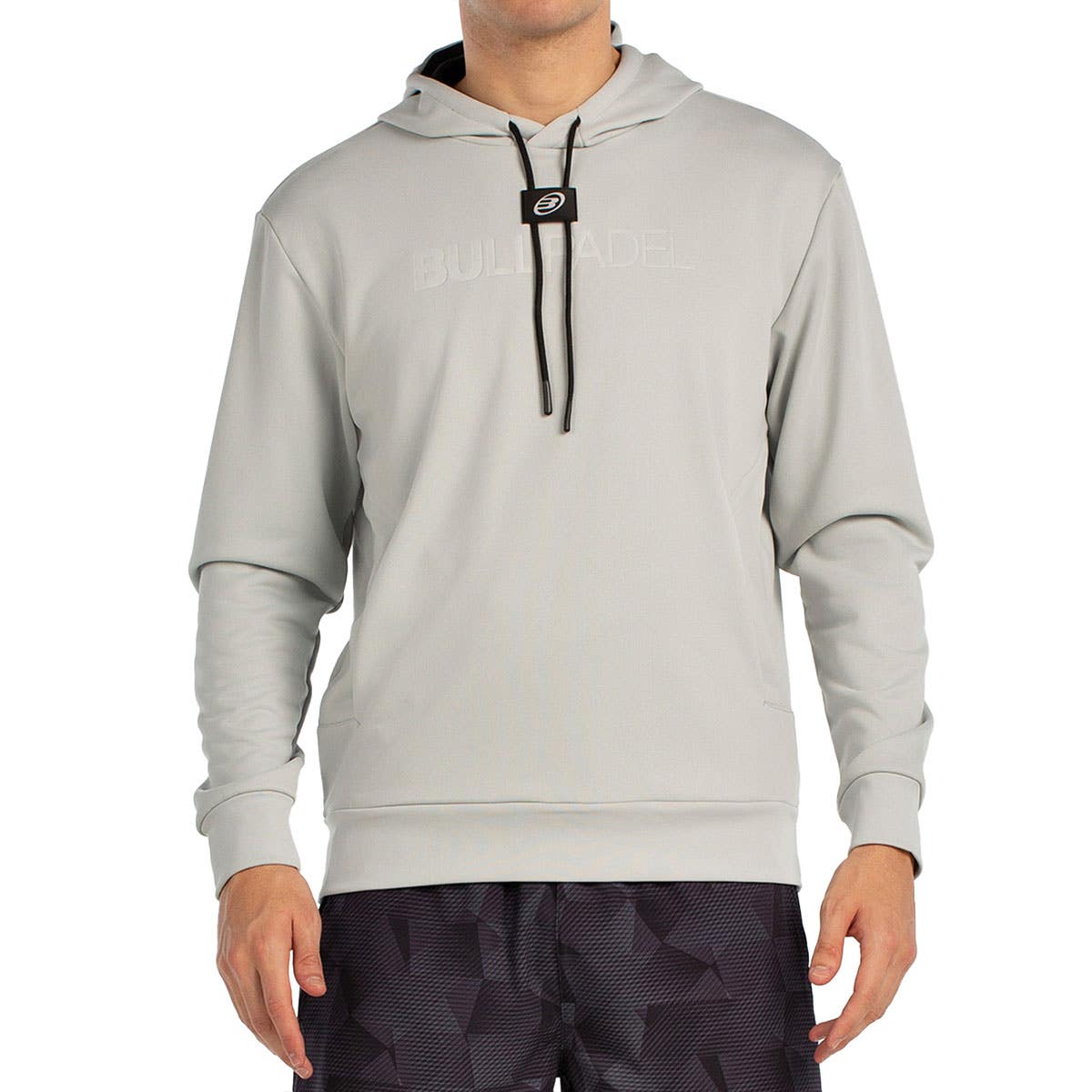Vooraanzicht van de lichtgrijze Bullpadel Hoodie Binee met capuchon en trekkoord