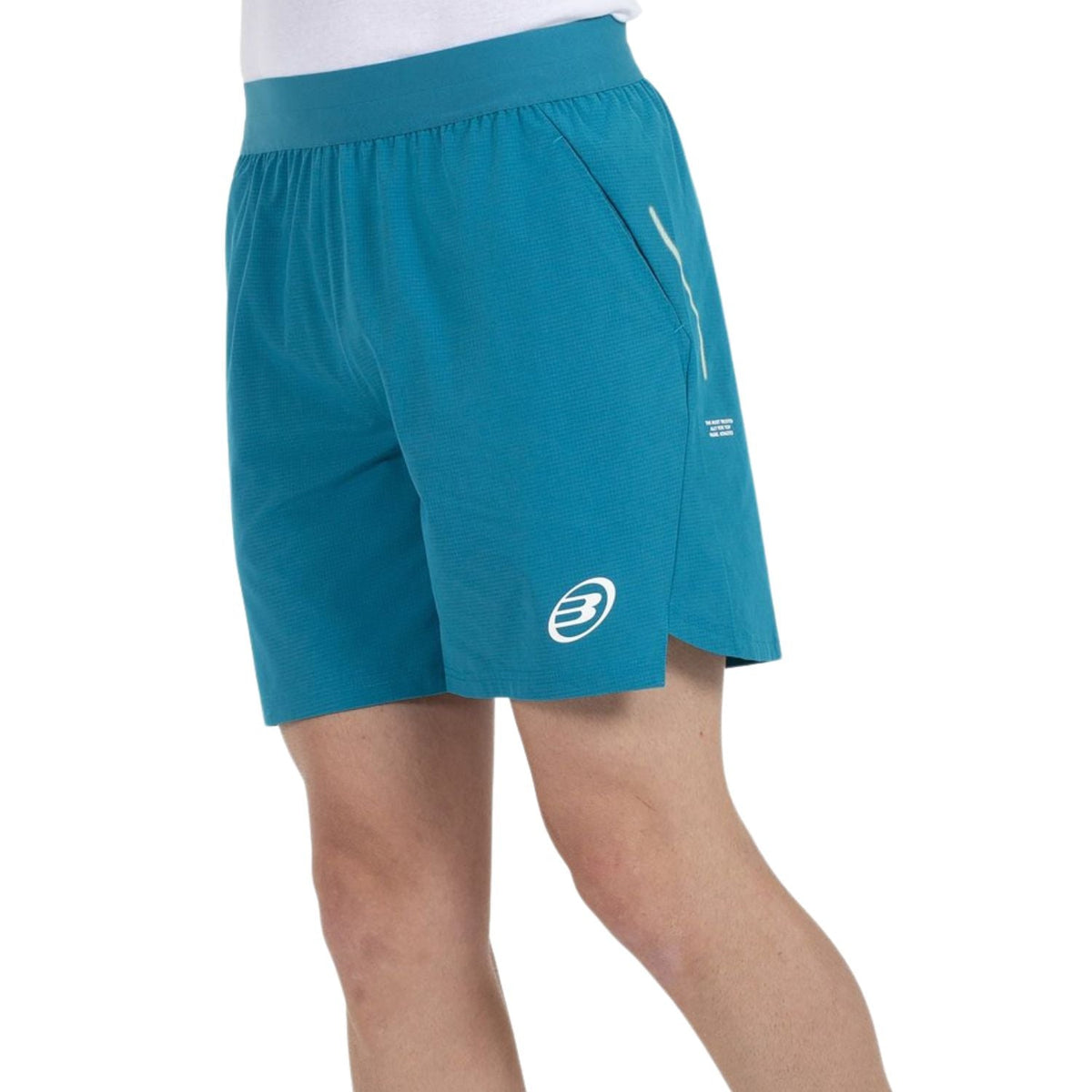 Turquoise Bullpadel Moncada kurze Shorts mit schrägem Reißverschluss