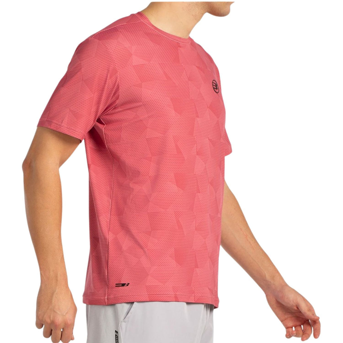 Zijaanzicht van het koraalroze Bullpadel T-Shirt Macondo met korte mouwen