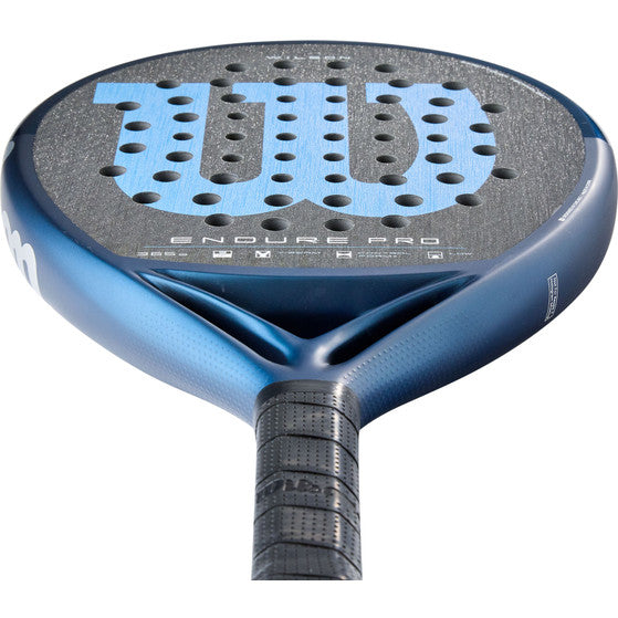 Nærbillede af den grå slagflade på Wilson Endure Pro V1 med ENDURE PRO-tryk