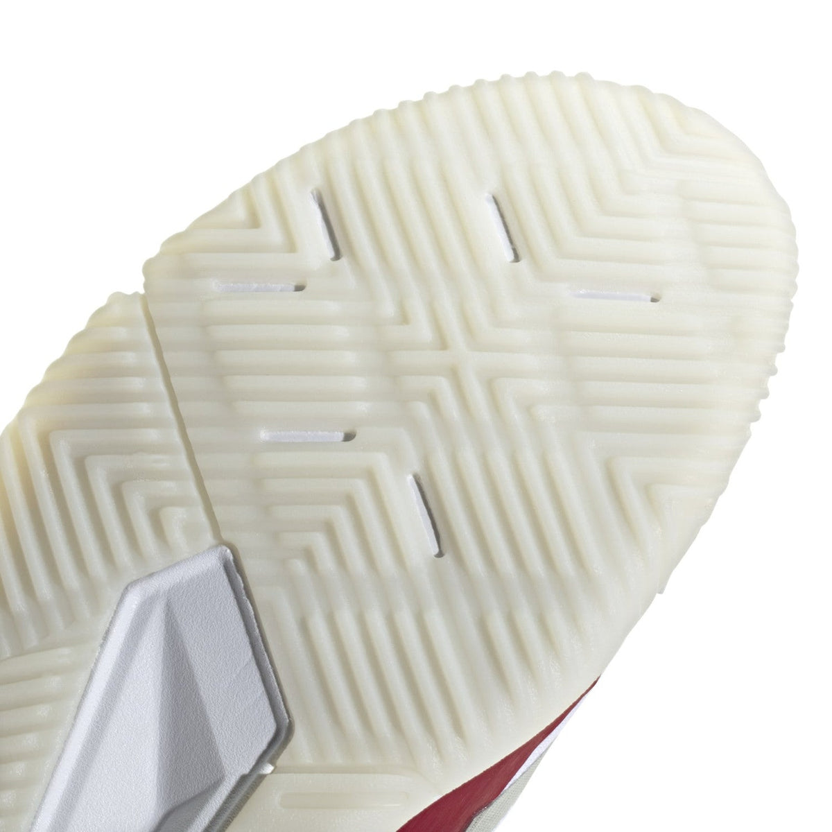 Close-up van het cremekleurige zoolprofiel van de Adidas Courtquick W