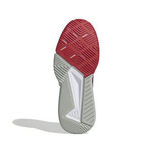 Witte zool van de Adidas Courtquick met rood profiel onder de voorvoet