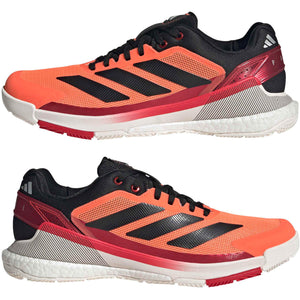 Paar Adidas Crazyquick Boost padelschoenen in oranje met zwarte strepen
