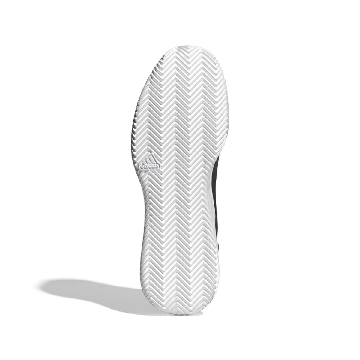 Witte zool van de Adidas Defiant Speed M met visgraatprofiel voor kunstgras