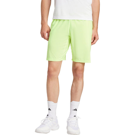 Adidas Ergo short voor heren in limoengroen, gedragen vooraanzicht
