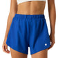 Bjorn Borg Ace 2-in-1 short voor dames in kobaltblauw, vooraanzicht op model