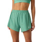 Bjorn Borg Ace 2-in-1 short voor dames in groen, vooraanzicht op model