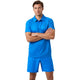 Model draagt de Bjorn Borg Ace Mesh Panel polo voor heren in blauw met short