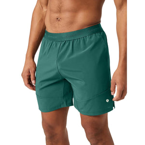 Zijaanzicht van de groene Bjorn Borg Ace Pro short met zijzak op het bovenbeen