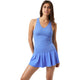 Model draagt de korenblauwe Bjorn Borg Ace tanktop met bijpassende rok