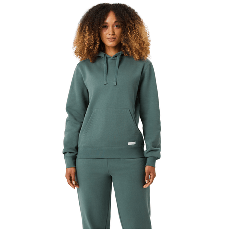 Damesmodel draagt de saliegroene Bjorn Borg Centre Hoodie W met bijpassende broek