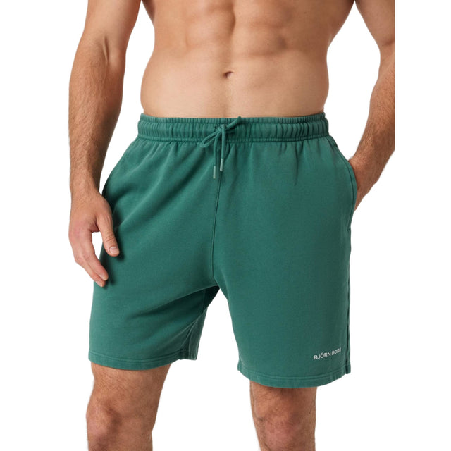 Vooraanzicht van de donkergroene Bjorn Borg Classic Sweatshorts met trekkoord en zakken