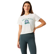 Damesmodel draagt het witte Bjorn Borg Cropped T-Shirt met Monaco print en donkere legging