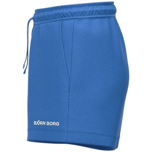 Zijaanzicht van de blauwe Bjorn Borg Essential 4 sweatshort met merknaam op de pijp