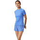 Damesmodel draagt het blauwe Bjorn Borg Light W T-Shirt met bijpassende korte broek