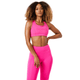 Damesmodel draagt de roze Bjorn Borg Mid Support Sports Bra met roze legging
