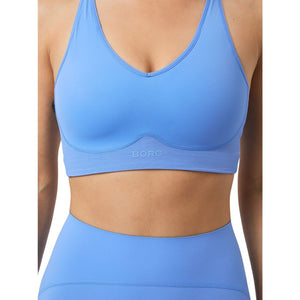 Close-up van de blauwe Bjorn Borg Mid V Support Sports Bra met diepe V-hals