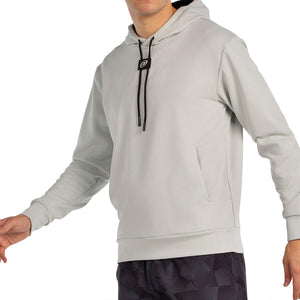 Zijaanzicht van de lichtgrijze Bullpadel Hoodie Binee met steekzak op het voorpand
