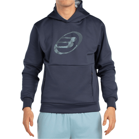 Vooraanzicht van de donkerblauwe Bullpadel Hoodie Boyal met logo in dezelfde tint