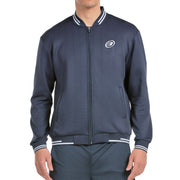 Vooraanzicht van het donkerblauwe Bullpadel Jacket Trombe met witte streepboorden