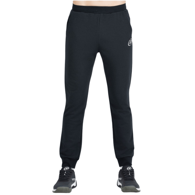 Vooraanzicht van de zwarte Bullpadel Pants Basar met logo op de linkerpijp