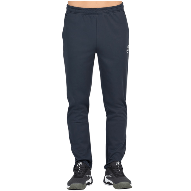 Vue de face du pantalon Bullpadel Pants Brome bleu foncé, avec le logo sur la jambe droite