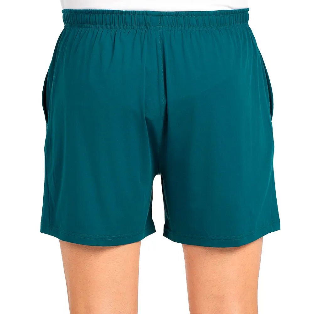 Schuin aanzicht van de petrolgroene Bullpadel Short Lijar met elastische tailleband