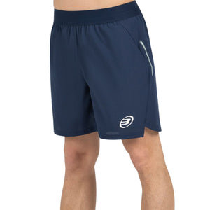 Donkerblauwe Bullpadel Moncada short schuin met ritszak op de zijkant
