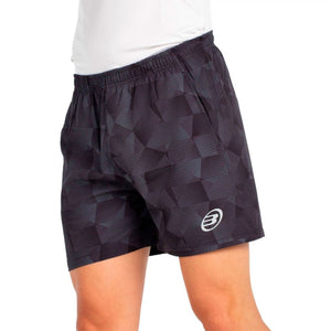 Schuin aanzicht van de antracietgrijze Bullpadel Short Monch met vlakkenprint