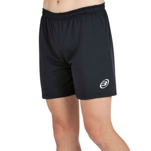 Schuin aanzicht van de antracietzwarte Bullpadel Short Monfort met wit Bullpadel-logo