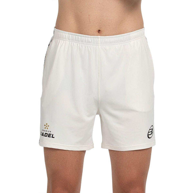 Bullpadel Preux short voor heren in wit, vooraanzicht met logo op beide pijpen