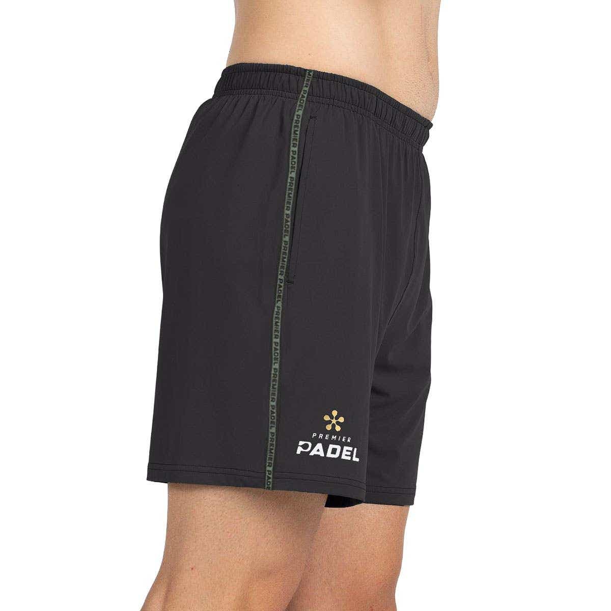 Zwarte Bullpadel Preux short van opzij met groene contrastbies