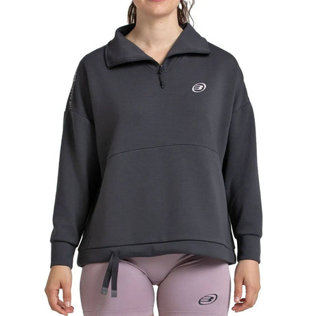Donkergrijze Bullpadel Alasia sweater gedragen met lila legging