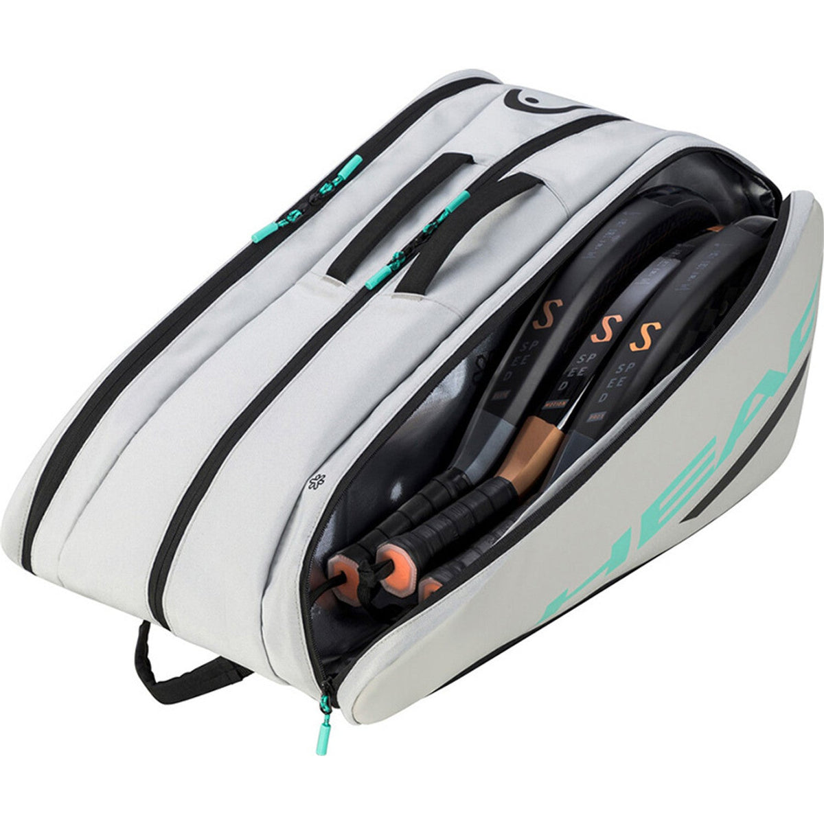 Geopende gebroken witte Head Tour L met rackets en turquoise binnenwerk zichtbaar