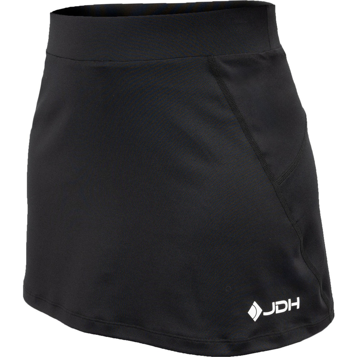 Schuin vooraanzicht van de zwarte Carbon Pro damesrok met wit JDH logo op de zoom
