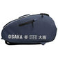 Zijaanzicht van de donkerblauwe Osaka Sports padeltas met wit logo en zwarte rits