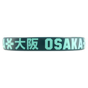 Close-up van de framerand van de Osaka Vision Power Teal met mintgroen OSAKA-logo