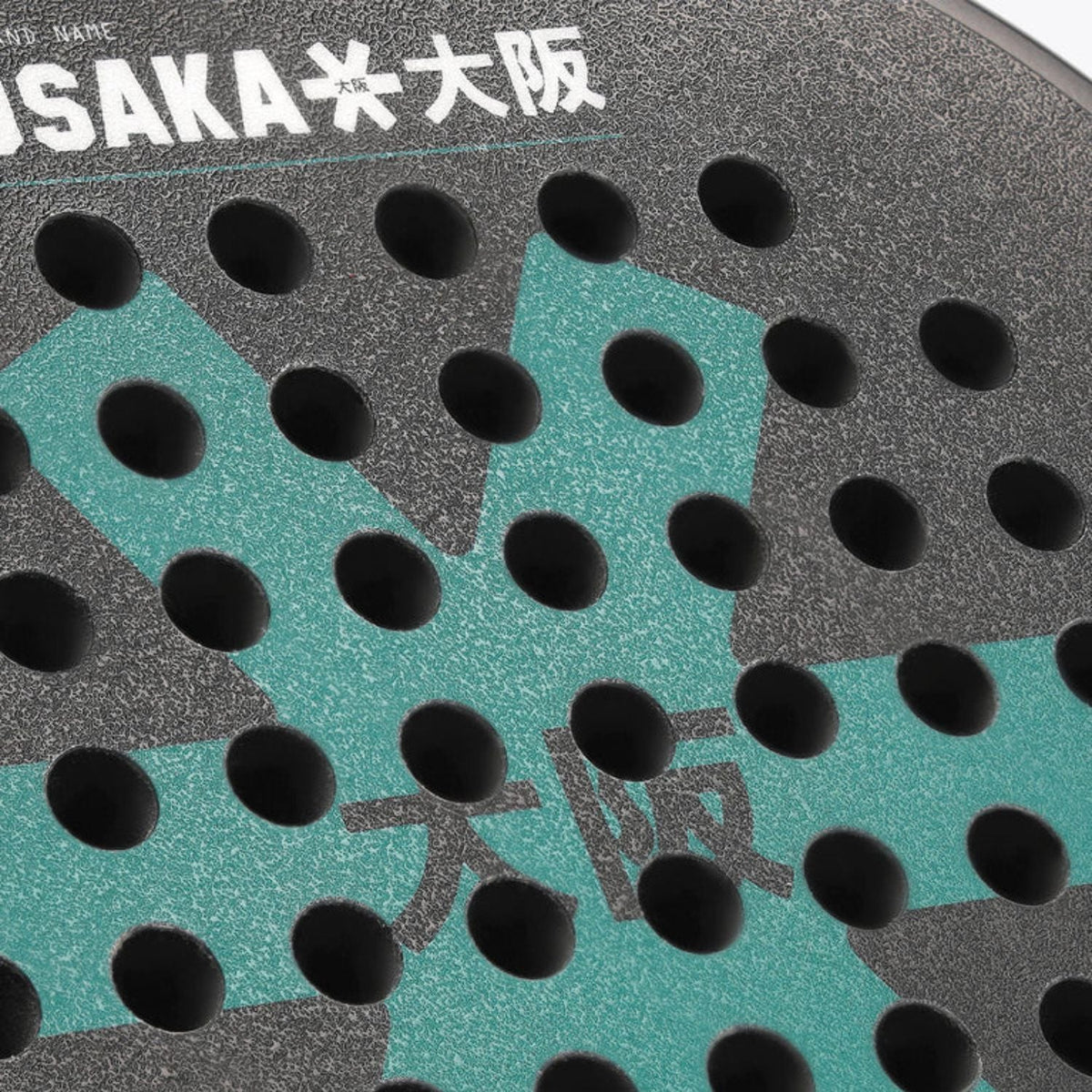 Macro-opname van het grijze slagvlak van de Osaka Vision Pro Control Teal