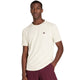Wilson Serve Out T-shirt in gebroken wit gedragen met bordeauxrode short